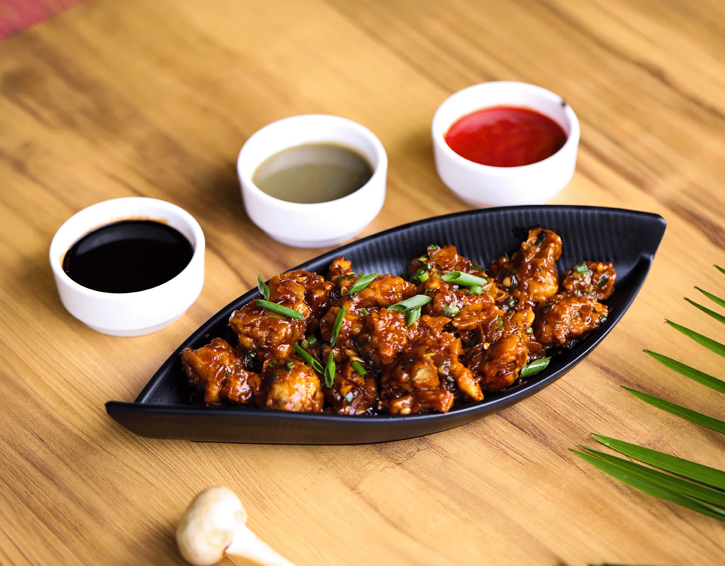Gobi manchurian garnished with spring onion